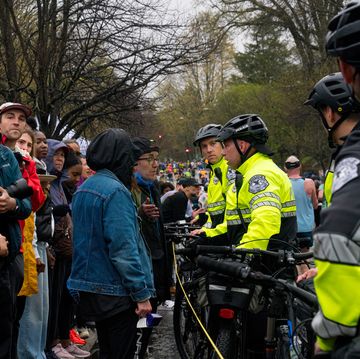 boston police block a group of fans at the 2023 boston marathon