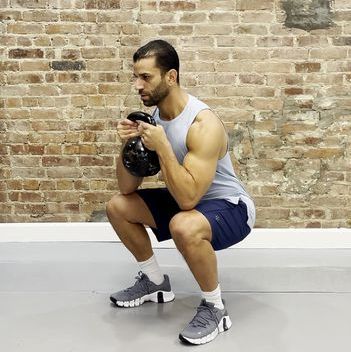 tamir practicing the goblet squat exercise